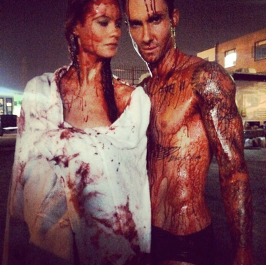 Adam Levine and Behati Prinsloo Get All Naked and Bloody for “Animals” Video