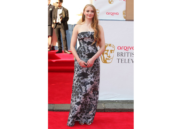 The redhead goes glam in this floor-length gown at the Arqiva British Academy Television Awards. 