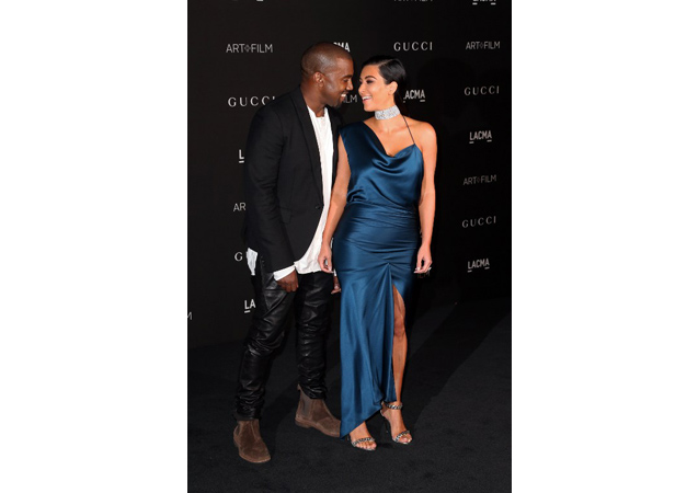 Kim and Kanye can't keep their eyes off of each other at the 2014 LACMA Art + Film Gala, but we can't keep our eyes off of Kanye's leather pants and Kim's gorgeous, blue gown.