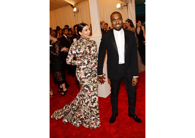 Kim proudly shows off her baby bump and her man in this stunning, floor-length floral dress at the Costume Institute Gala. 
