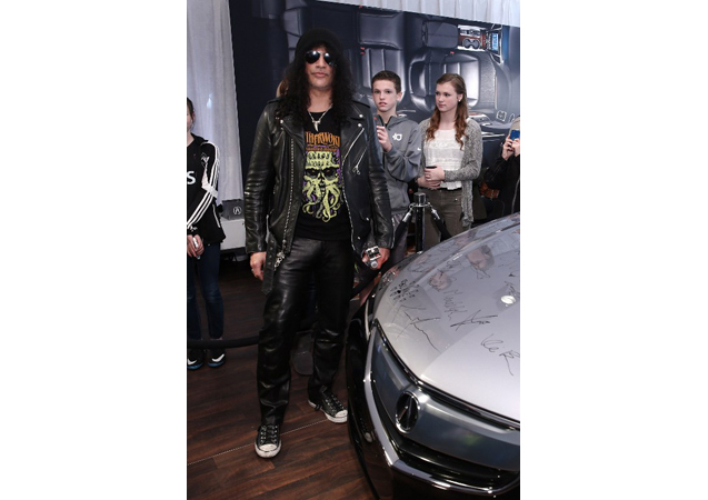 Slash signed an Acura and wore his go-to black leathers, aviators, and trademarked top hat.