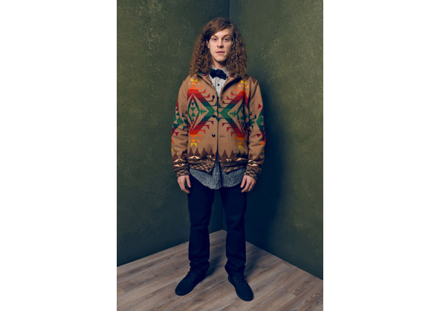 Blake Anderson keeps it satirical as always in a flamboyant cardigan and bowtie. 