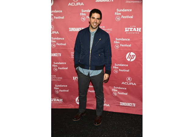 Eli Roth rocks a navy blue bomber with gold detail over a dress shirt at the showing of his latest film Knock Knock, starring Keanu Reeves.