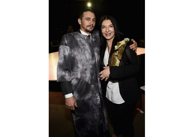 Franco with Marina Abramovic earlier this month, wearing a grey gown over a black suit.