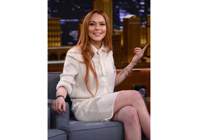 Looking cute in a white button-up one-piece on Jimmy Fallon. 