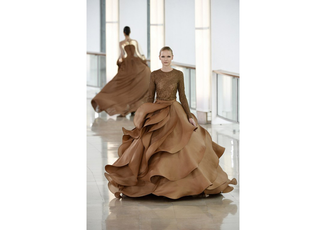 This voluminous layers and rich chocolate hue give a luxurious feel to Stephane Rolland's gown.