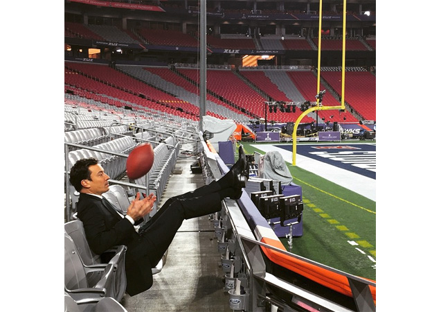 Jimmy Fallon looked dapper as tried his hand at throwing a football.