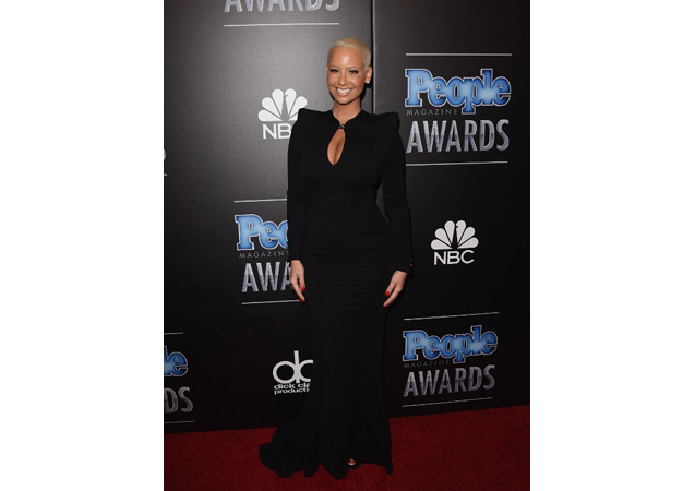 Amber Rose looked stunning in this plunging, floor length gown at the PEOPLE Magazine Awards in Beverly Hills. 